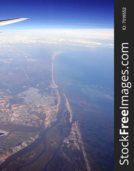 Shot from the airplane over sea coast. Shot from the airplane over sea coast