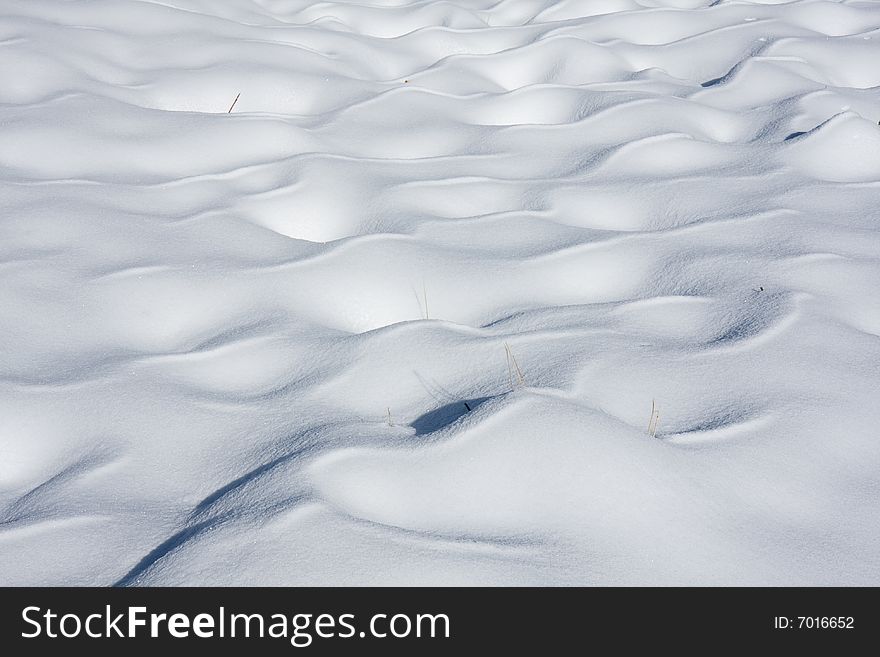 Wavy snow cover in Swiss Alps. Wavy snow cover in Swiss Alps.