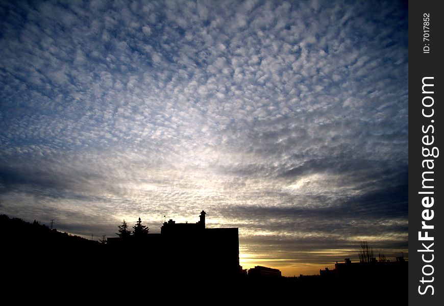 Beautiful cloudy sky and sunset over Saint Etienne in France. Beautiful cloudy sky and sunset over Saint Etienne in France