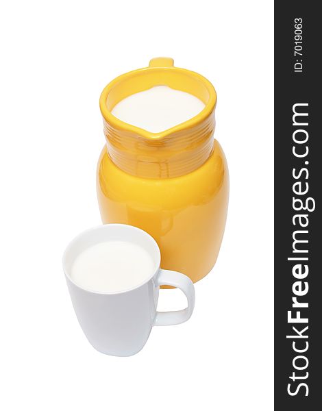 Jug and a cup of milk isolated on white. Jug and a cup of milk isolated on white.