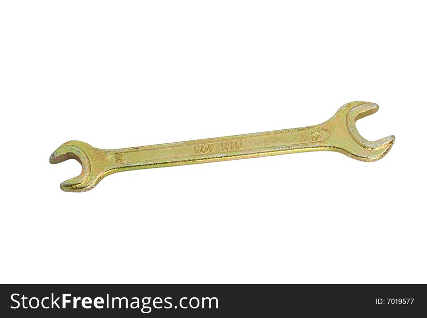 Brass spanner isolated over white