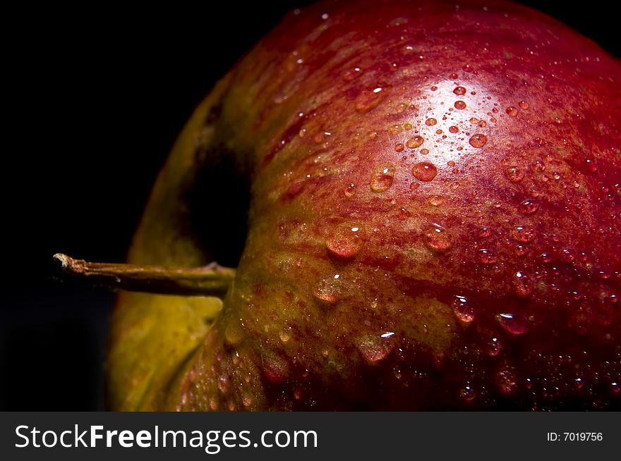 Close up of an apple isolated on black background. Close up of an apple isolated on black background