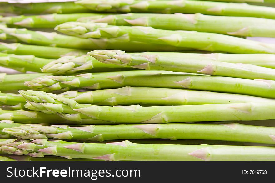 Background of green asparagus. Close up. Background of green asparagus. Close up