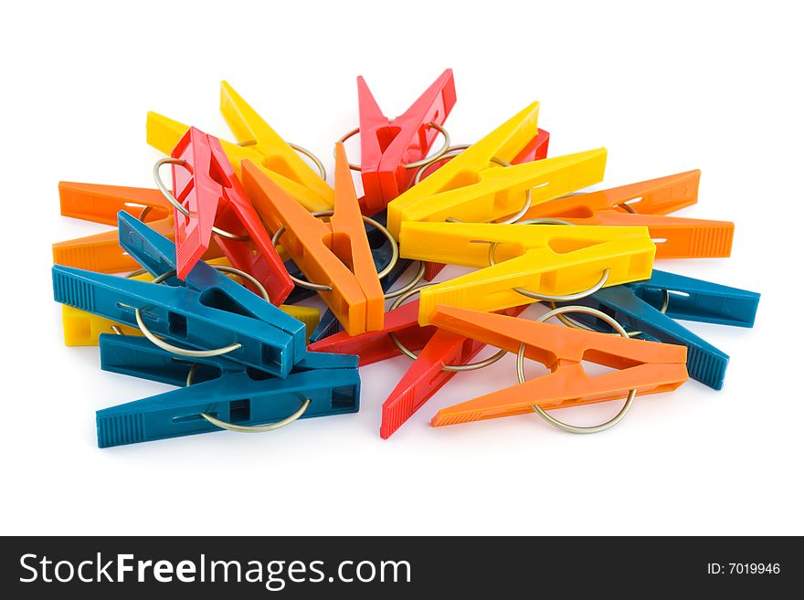 Heap of clothespins isolated on white background