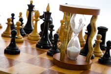 Chess Composition With Hourglass Stock Photography