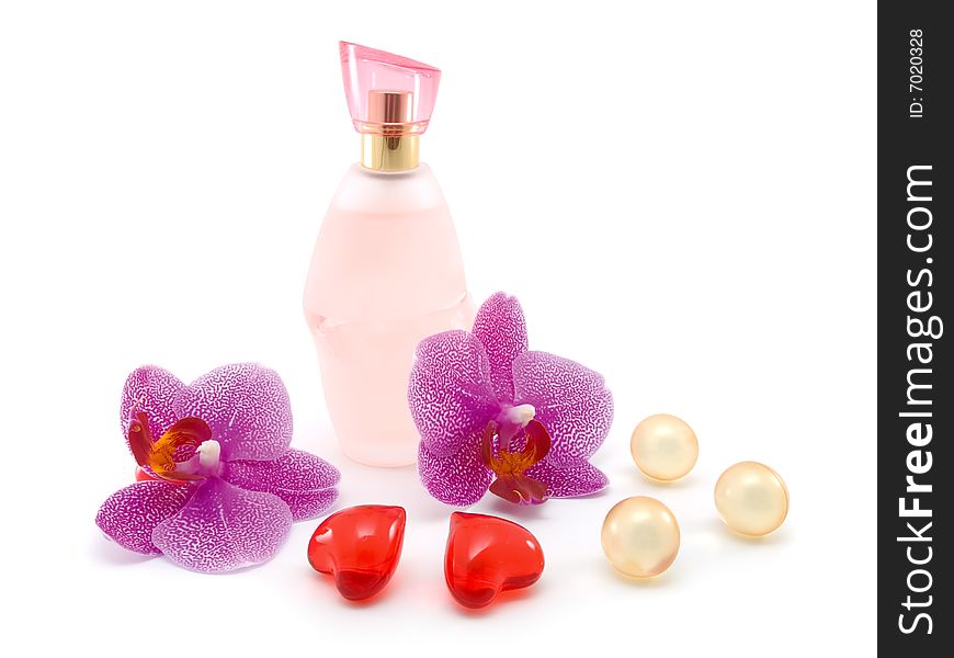 Bottle of perfume and orchid isolated on white background.