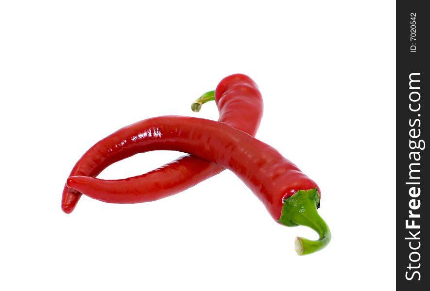 Two bitter pepper of red colour isolated on a white background. Two bitter pepper of red colour isolated on a white background