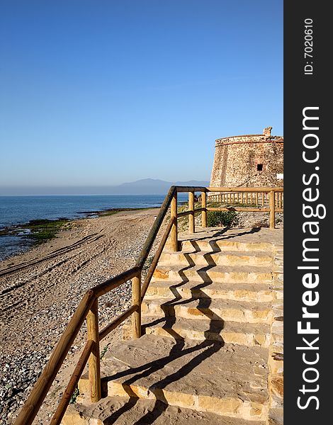 Moorish Tower Beach And Steps In Spain