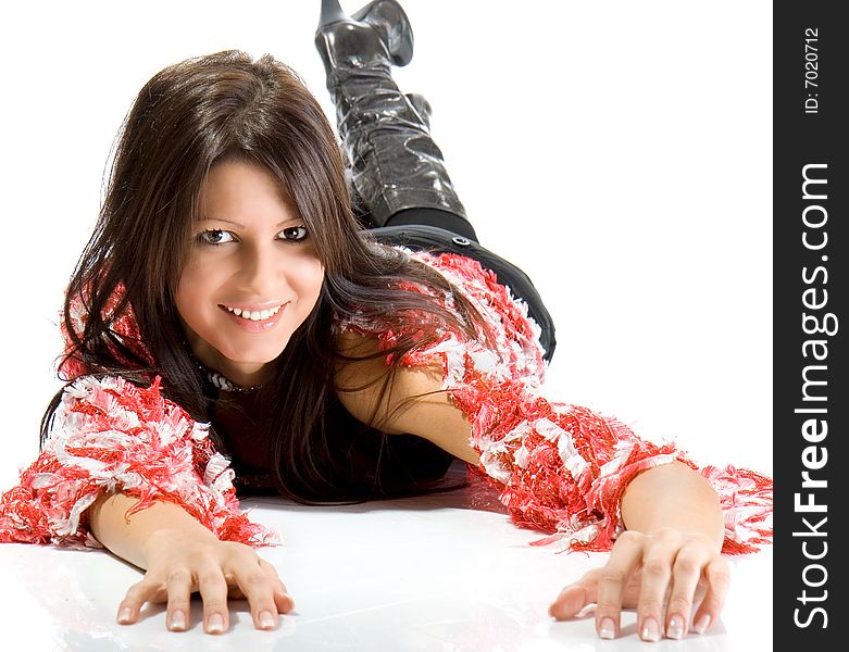 Beautiful young woman laying on floor smiling. Shot in studio over white.