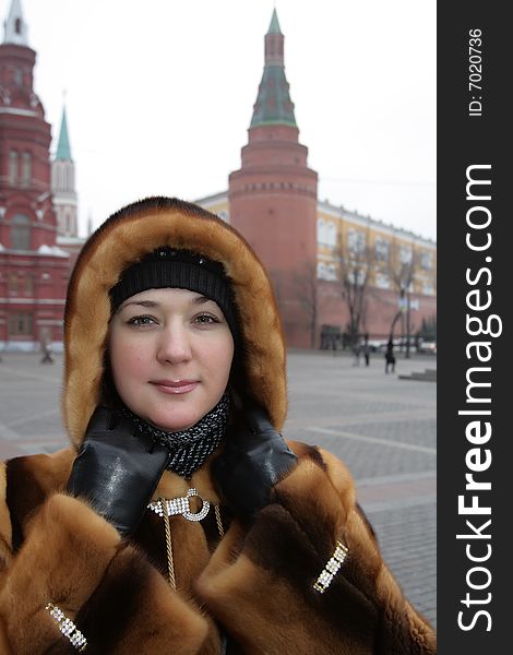 Portrait of girl in winter coat in Kremlin