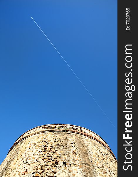 Moorish Tower blue sky and aeroplane