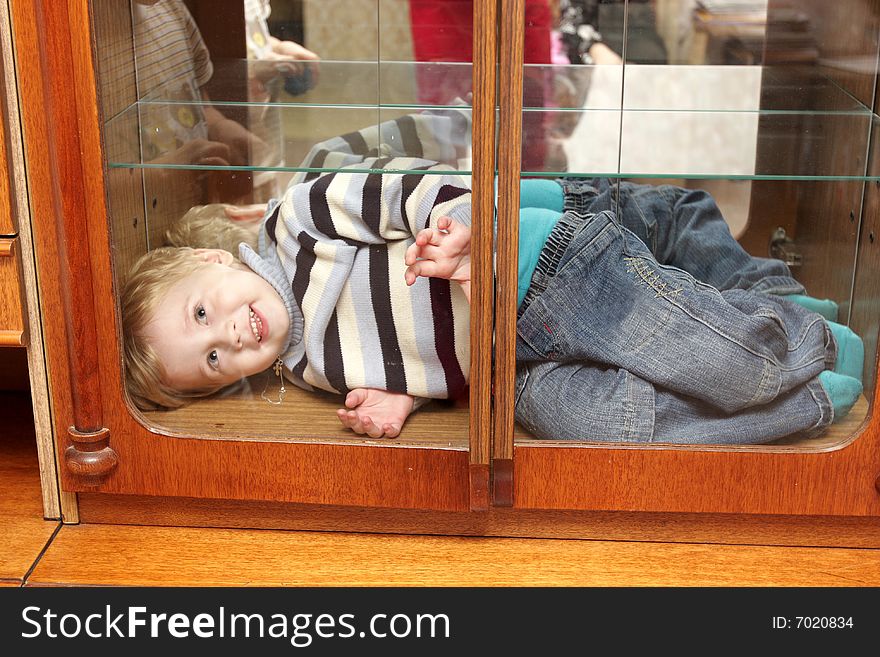 The smiling child in a wall unit. The smiling child in a wall unit