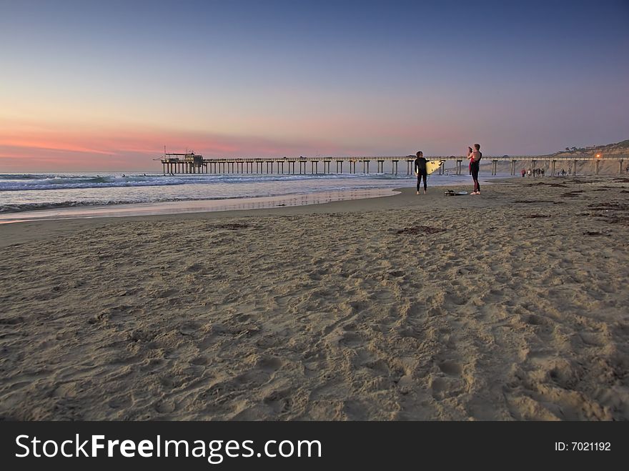 Surfer at Sunset, La Jolla shores, San Diego, California