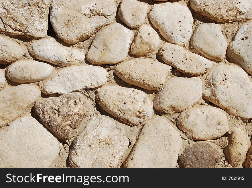 Fragment of old stone wall close up. Fragment of old stone wall close up