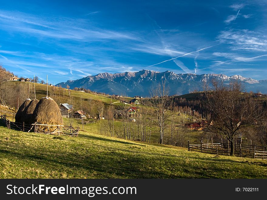 Autumn landscape in Magura village, with Bucegi mountains in background. Autumn landscape in Magura village, with Bucegi mountains in background