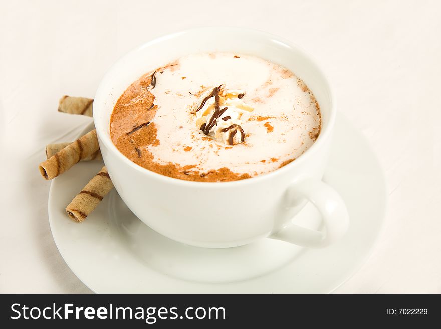 Rich hot chocolate with whipped cream, chocolate, caramel, and cinnamon. Served with cookies.