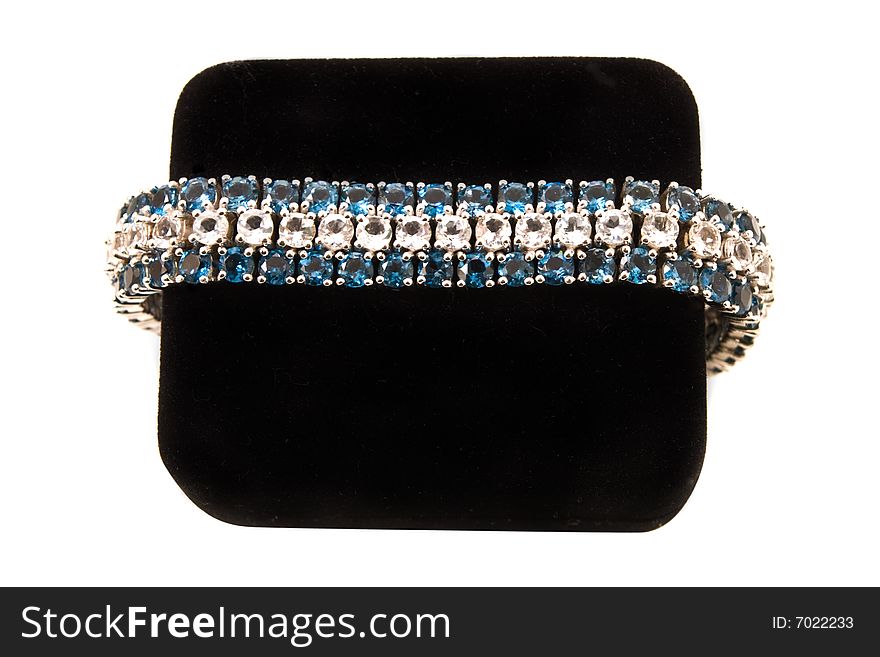 Blue and white diamond bracelet on a black velvet box