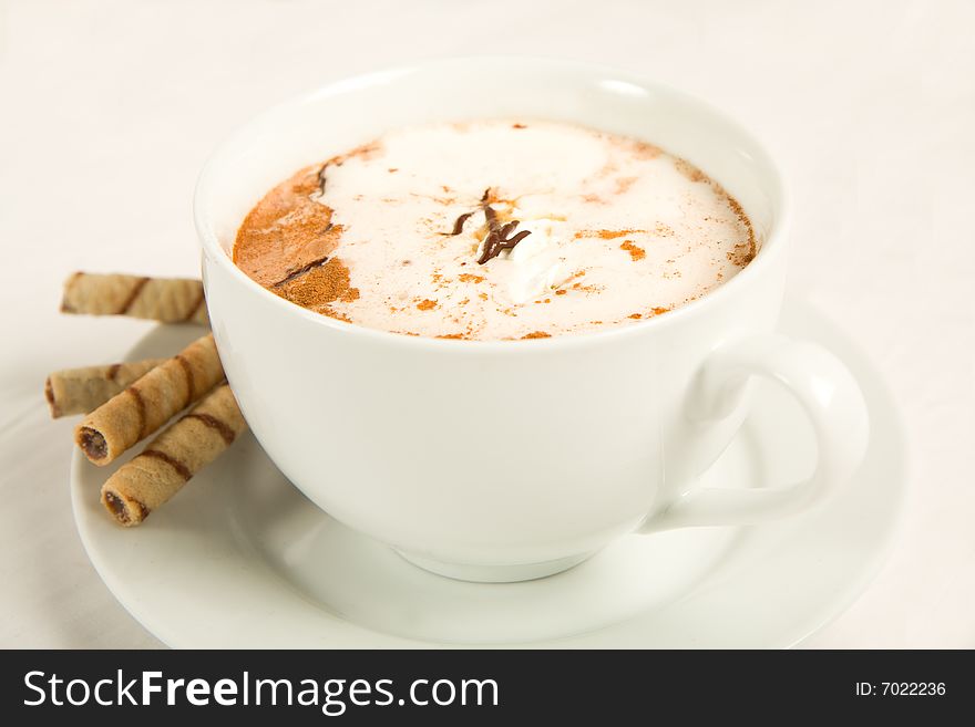 Rich hot chocolate with whipped cream, chocolate, caramel, and cinnamon. Served with cookies.