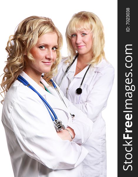 Friendly young doctors smiling over a white background