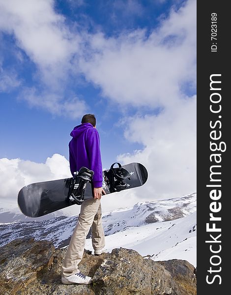 Snowboarder At The Top Of The Hill