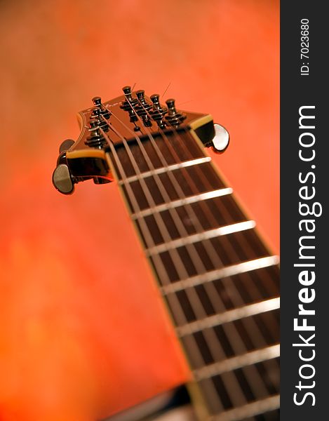 Close-up of the top of a black electric guitar (shallow dof)