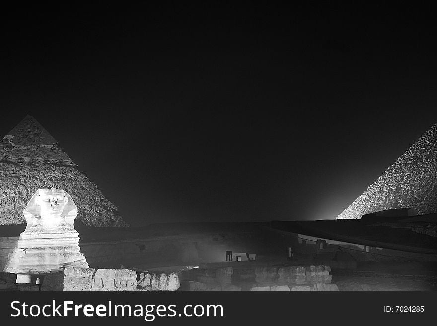 The ancient pyramids of Egypt, in Cairo, at night.