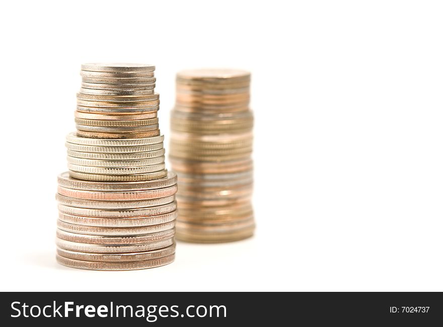 Pile of coins isolated on white background