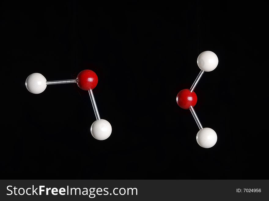 A 3 dimensional model of a water molecule. A 3 dimensional model of a water molecule.