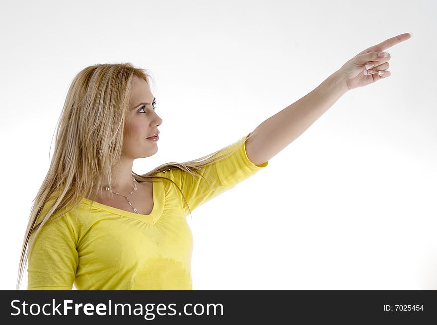 Smiling woman pointing side on an isolated white background