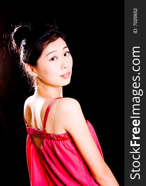 Portrait of beautiful asian female back in red. Portrait of beautiful asian female back in red