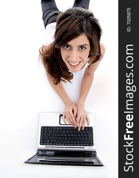 Laying woman working on laptop on an isolated background