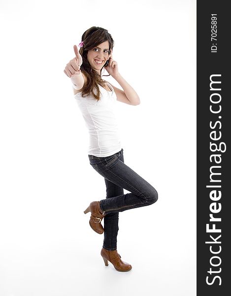 Standing woman with cell phone wishing good luck with white background