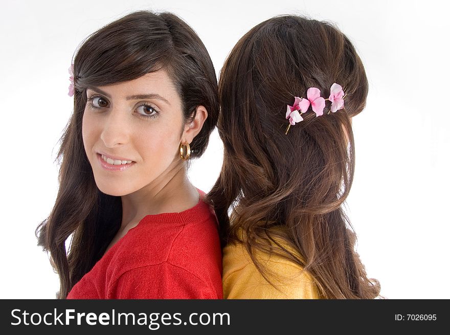 Portrait of brunette sisters on an isolated white background