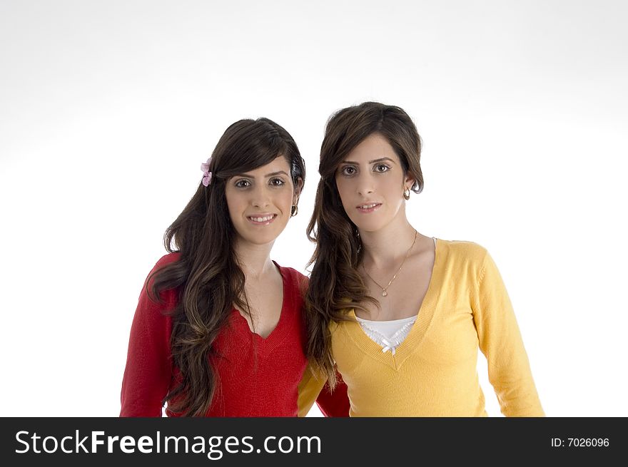 Portrait of smiling sisters on an isolated background