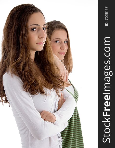 Two young friends posing at camera on an isolated white background