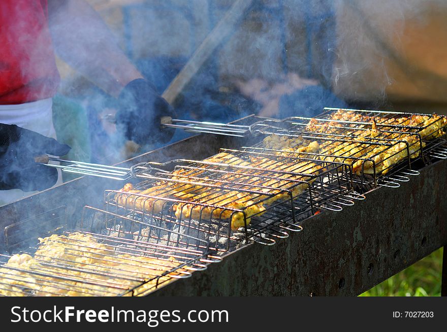 Cooking outdoors on barbecue grill