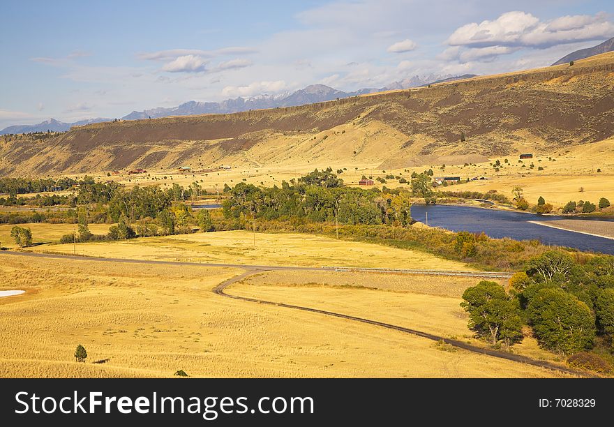 The river Missouri is beautifully bent between brightly yellow meadows. The river Missouri is beautifully bent between brightly yellow meadows