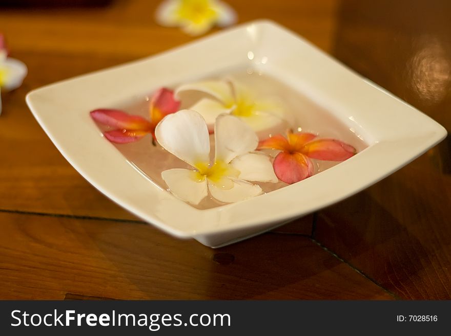 Flower petals in a bowl at a spa, shallow DOF