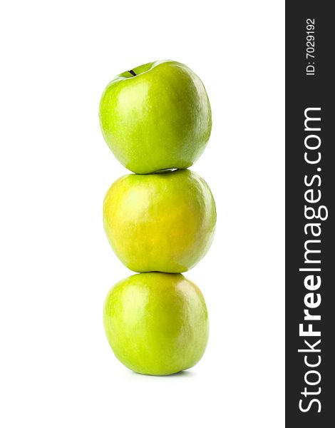 Three green apples isolated