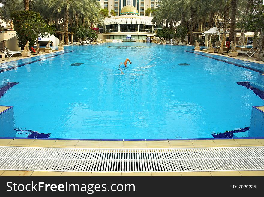 The first morning heat on training sportswoman in pool of magnificent hotel. The first morning heat on training sportswoman in pool of magnificent hotel