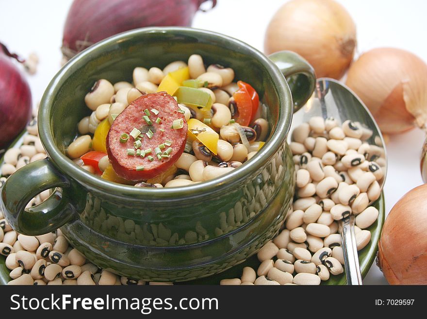 A stew of fresh beans, vegetables and sausages. A stew of fresh beans, vegetables and sausages