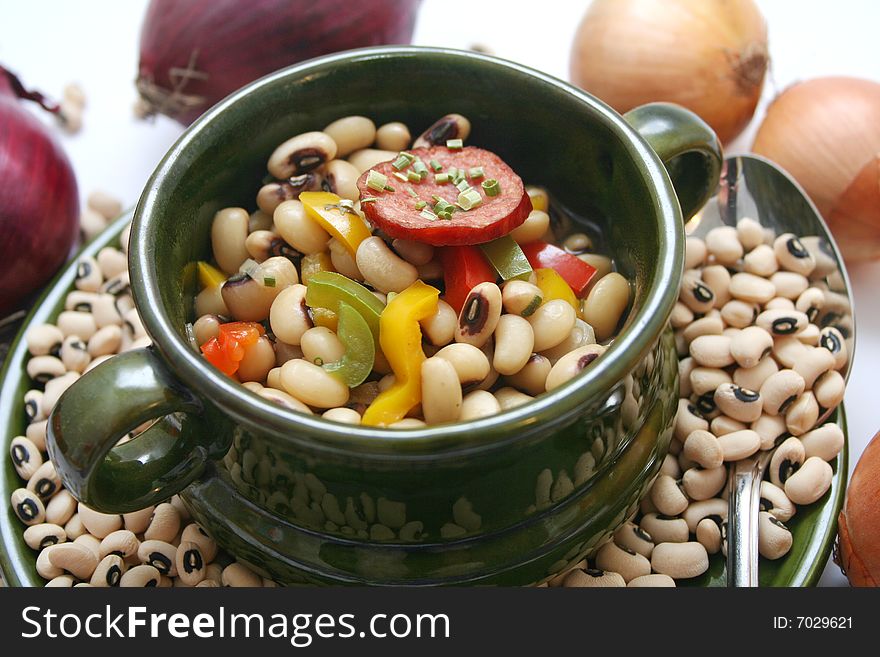 A stew of fresh beans, vegetables and sausages. A stew of fresh beans, vegetables and sausages
