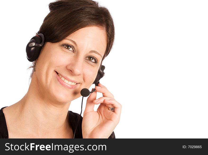 Young friendly Caucasian brunette woman with headset, smiling during conversation and looking up. Young friendly Caucasian brunette woman with headset, smiling during conversation and looking up