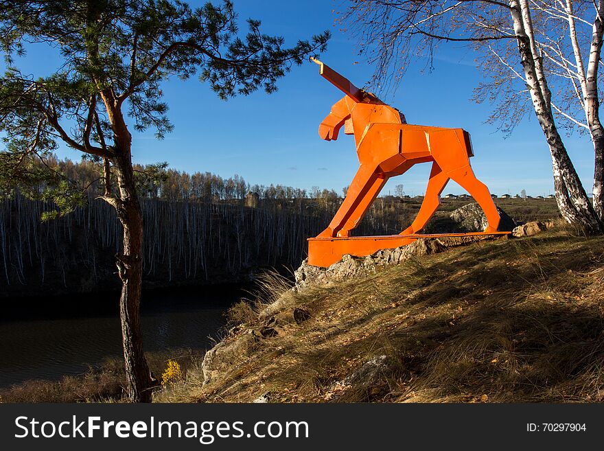 Orange moose on the river Bank in Russia in the Urals