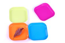 Leaf And Colorful Plates Royalty Free Stock Image Leaf And Colorful Plates Royalty Free Stock Image