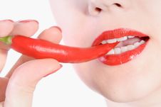 Biting Red Hot Chili Pepper Royalty Free Stock Image