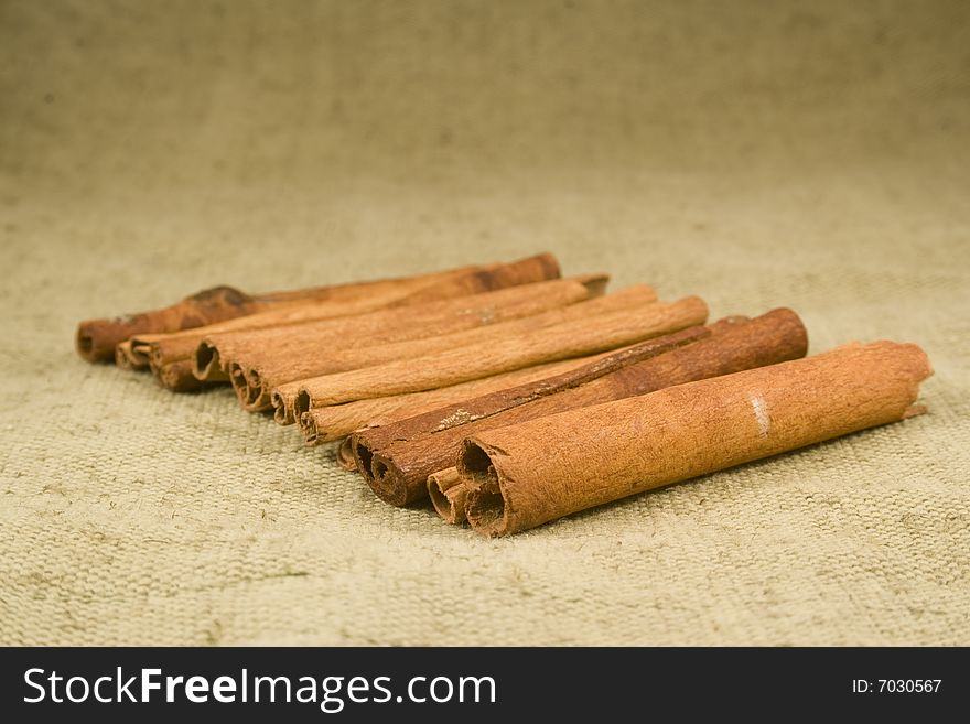 Whole cinnamon sticks on burlap