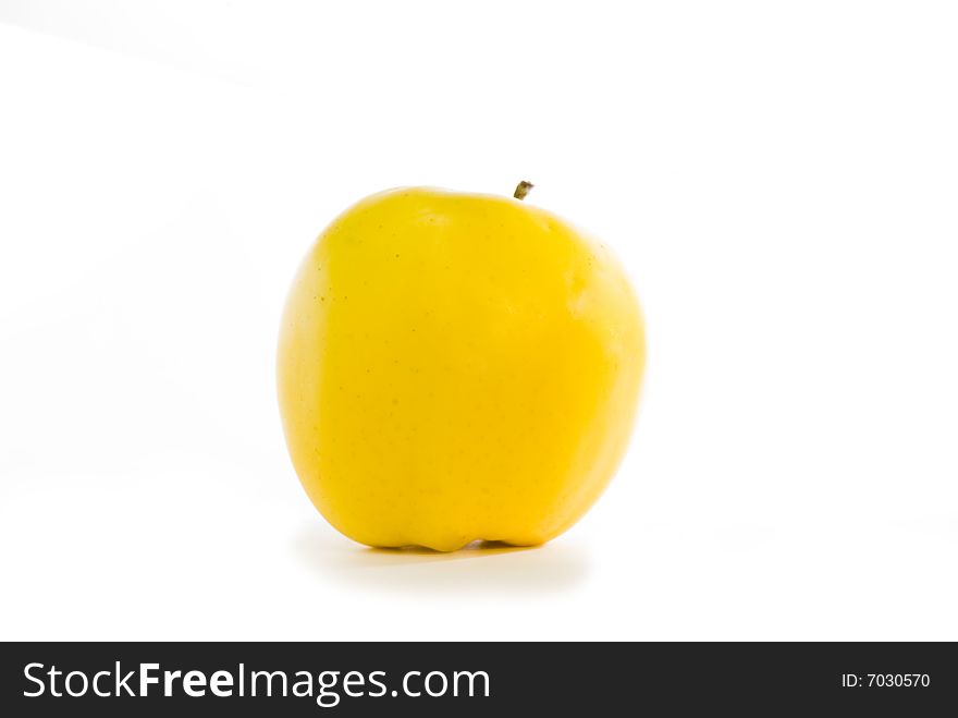 Yellow apple with shade on the isolated background