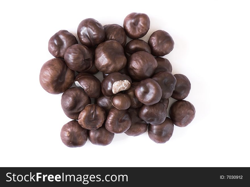 A few brown chestnuts are on a white background