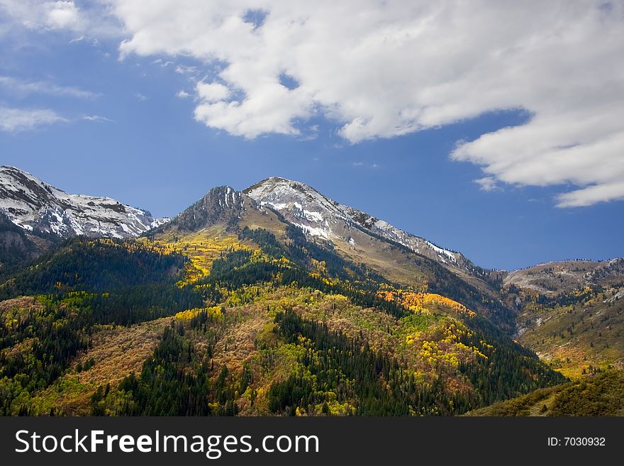 Mountain in the fall with blue sky and clouds. Mountain in the fall with blue sky and clouds